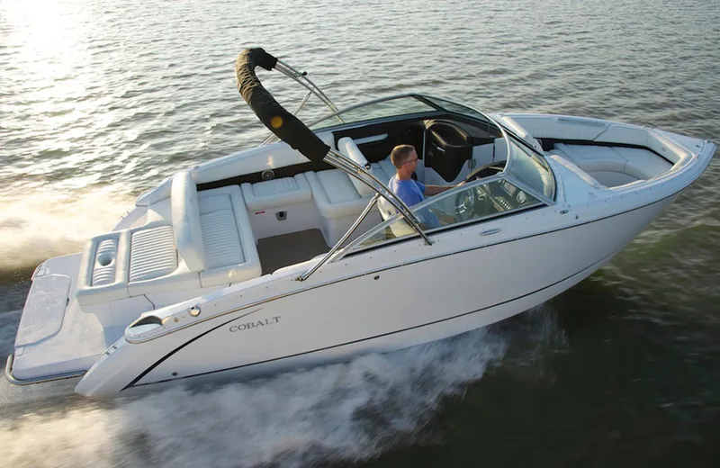 Slide: The Image of Manufacturer Provided Image: 2014 Cobalt R5 boat cruising on water, side view. - 2