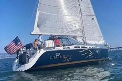 The Image of Sailing yacht Catalina 470, 2000 model, with American flag on open water. - 0