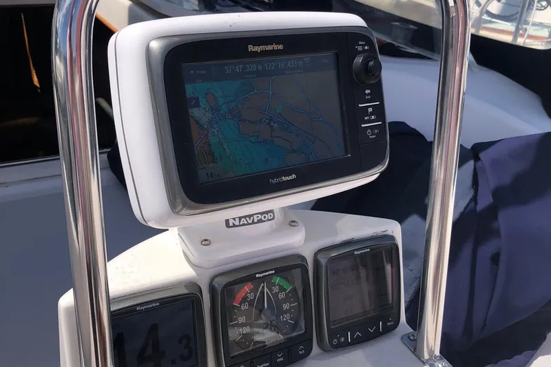 Slide: The Image of Navigation equipment on a 2000 Catalina 470 sailboat, featuring Raymarine displays. - 20