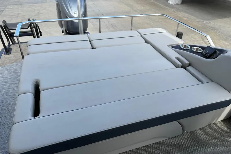 Slide: The Image of 2024 Bennington 23 RSB boat with spacious rear seating and cup holders. - 17