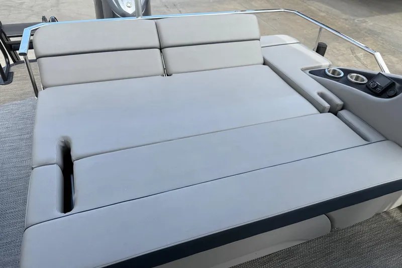 Slide: The Image of 2024 Bennington 23 RSB boat with spacious, cushioned seating and built-in cup holders. - 18