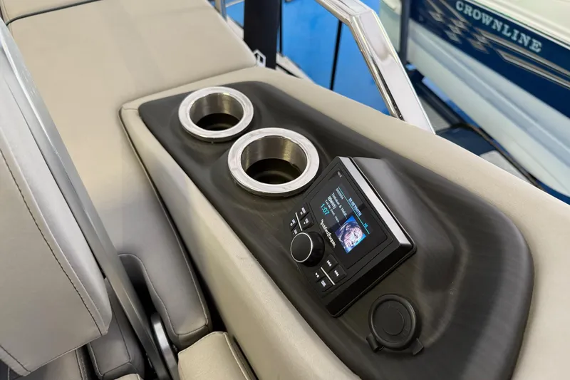 Slide: The Image of 2024 Bennington 23 RSB boat console with stereo system and cup holders. - 27