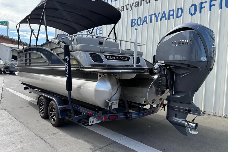 Slide: The Image of 2024 Bennington 23 RSB pontoon boat with Yamaha outboard motor at boatyard. - 7
