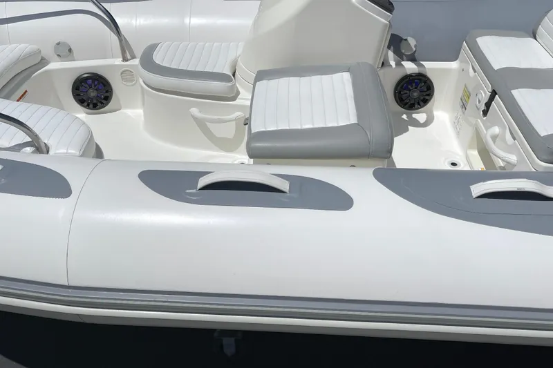 Slide: The Image of 2007 Zodiac Yachtline Deluxe 420 boat interior with gray and white seating. - 10