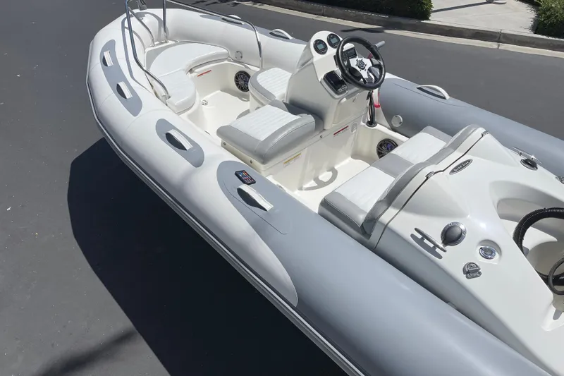 Slide: The Image of 2007 Zodiac Yachtline Deluxe 420 inflatable boat with sleek design and modern controls. - 12