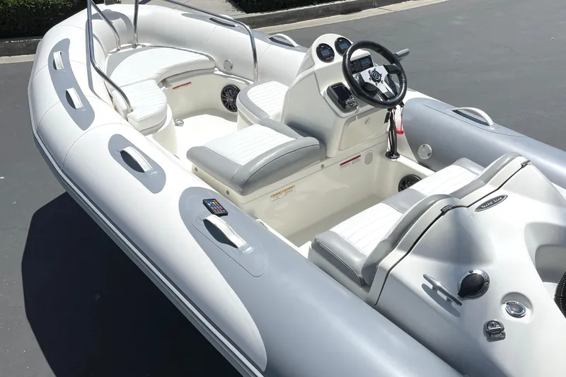 Slide: The Image of 2007 Zodiac Yachtline Deluxe 420 inflatable boat with white seating and steering console. - 17