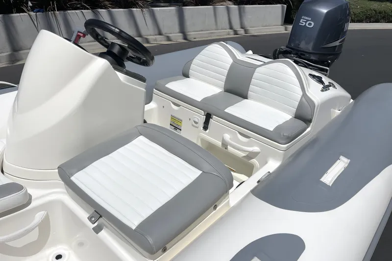 Slide: The Image of 2007 Zodiac Yachtline Deluxe 420 boat interior with white and gray seating, Yamaha 50 engine. - 8