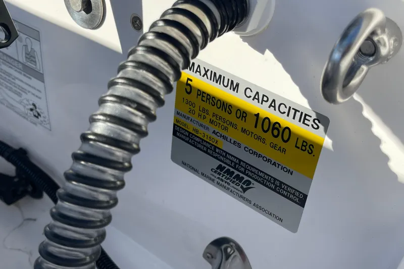 Slide: The Image of Achilles HB-315DX 2020 boat capacity label, 5 persons or 1060 lbs maximum. - 19