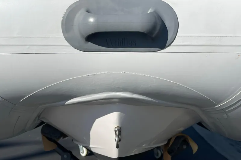 Slide: The Image of 2020 Achilles HB-315DX inflatable boat, close-up of handle and hull design. - 23