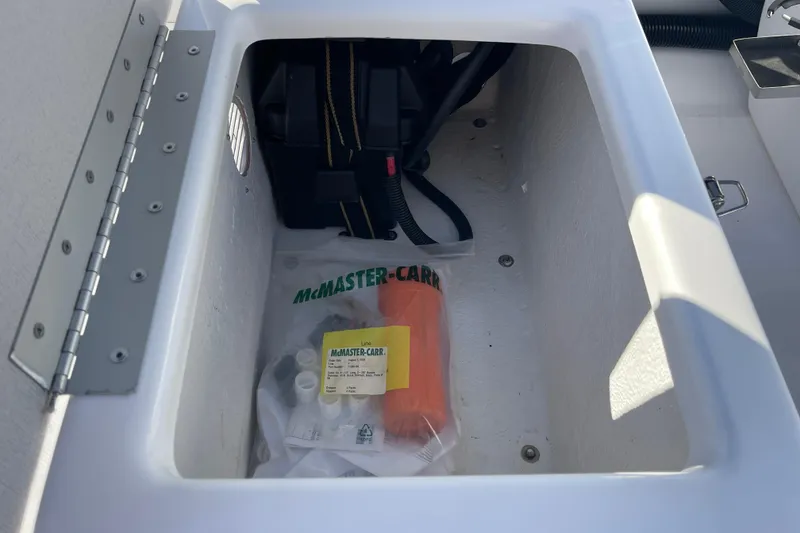Slide: The Image of Storage compartment of 2020 Achilles HB-315DX boat with McMaster-Carr supplies. - 6