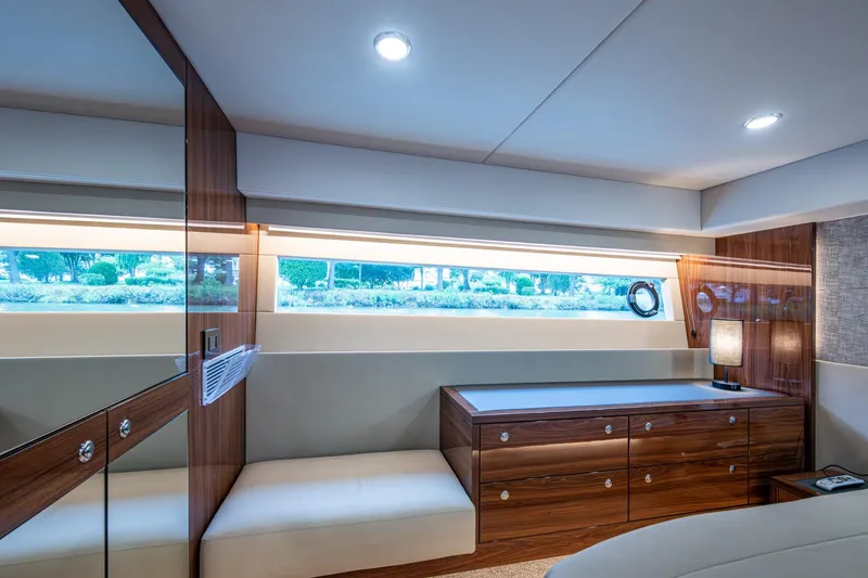 Slide: The Image of Luxurious interior of 2023 Maritimo M55 yacht with elegant wood finishes and modern lighting. - 100