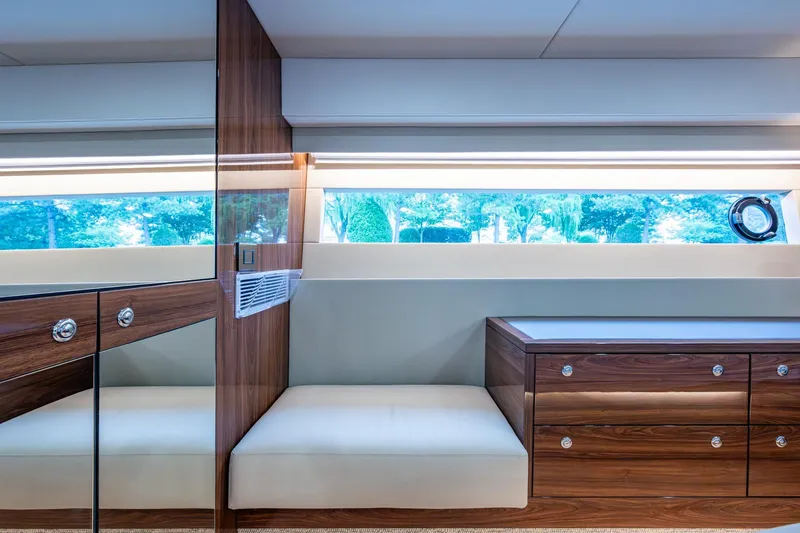 Slide: The Image of Luxurious interior of 2023 Maritimo M55 yacht with elegant wood finish and large window. - 101