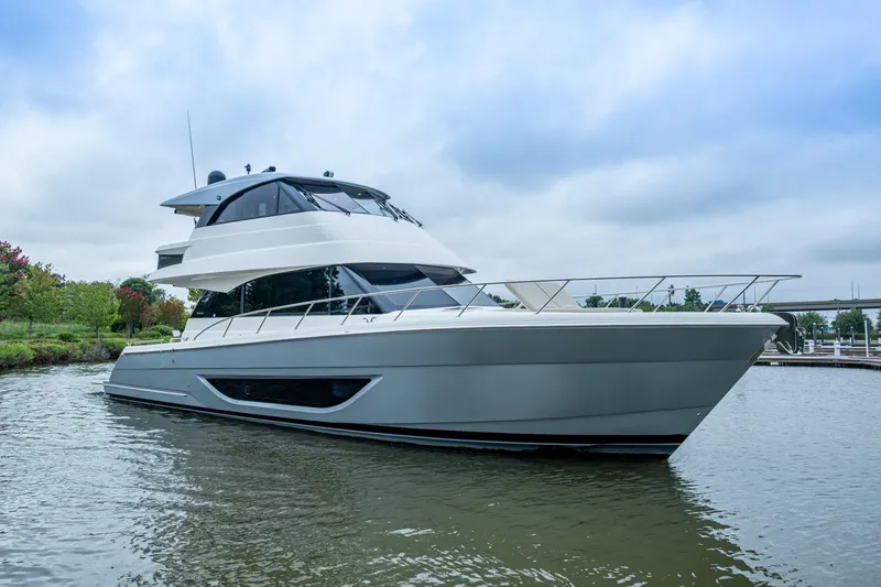 Slide: The Image of 2023 Maritimo M55 yacht on calm water, showcasing sleek design and modern features. - 112