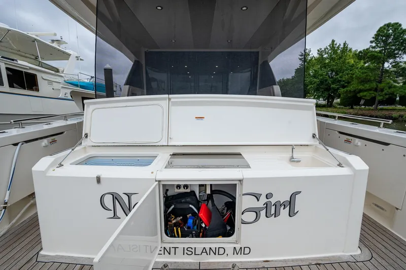 Slide: The Image of 2023 Maritimo M55 yacht stern view with storage compartment open. - 132