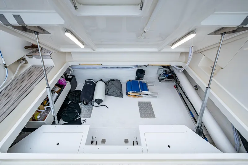 Slide: The Image of 2023 Maritimo M55 yacht storage area with equipment and supplies neatly organized. - 138