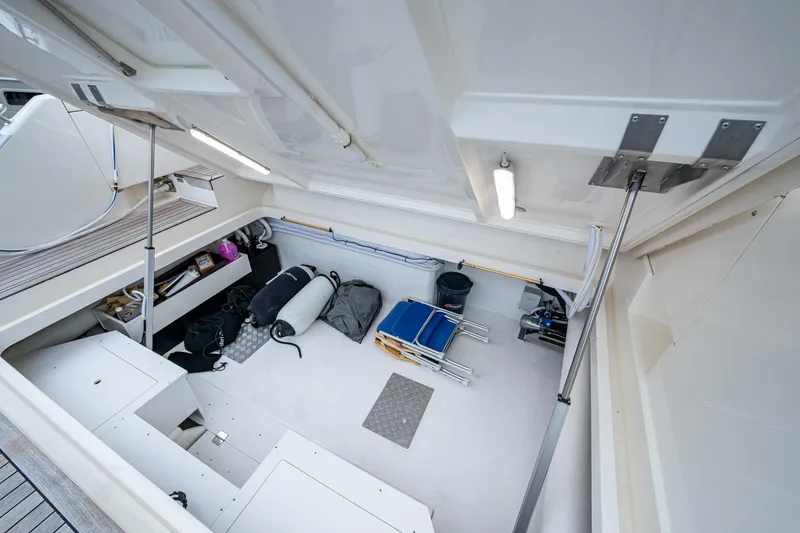 Slide: The Image of 2023 Maritimo M55 yacht storage compartment with equipment and supplies. - 139