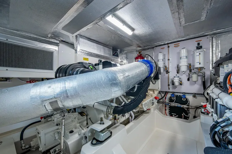 Slide: The Image of Engine room of 2023 Maritimo M55 yacht, featuring advanced mechanical systems and components. - 140