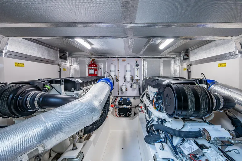 Slide: The Image of Engine room of 2023 Maritimo M55 yacht, featuring advanced machinery and equipment. - 141