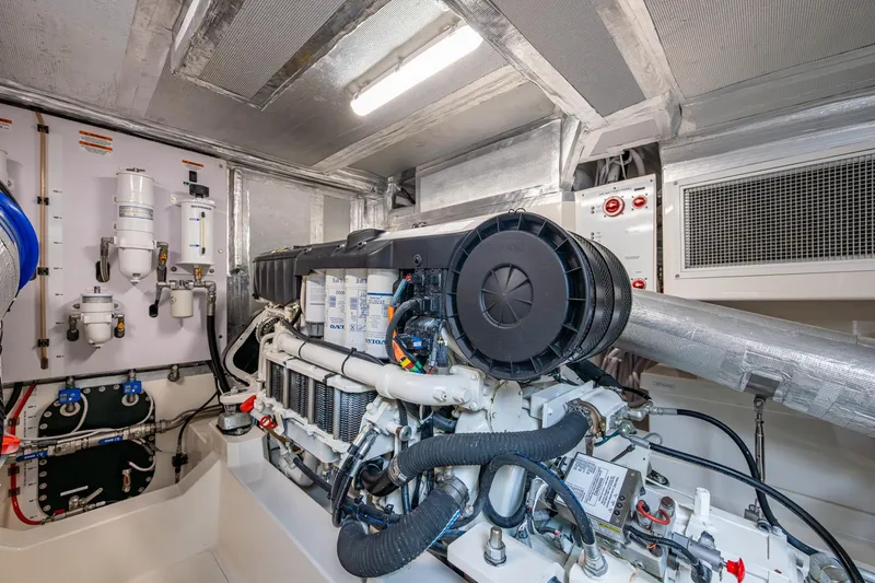 Slide: The Image of Engine room of 2023 Maritimo M55 yacht, showcasing advanced machinery and components. - 142