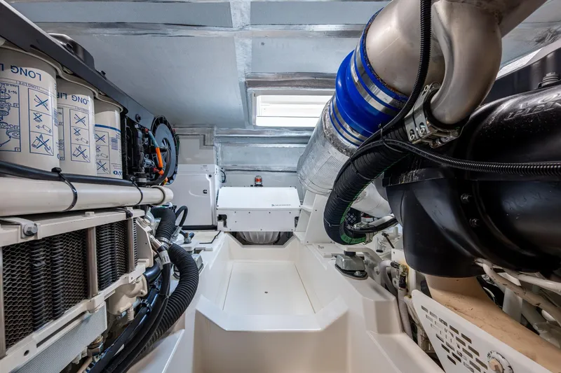 Slide: The Image of Engine room of 2023 Maritimo M55 yacht, showcasing advanced mechanical systems and components. - 143