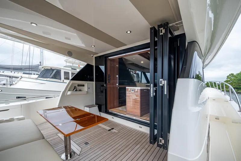 Slide: The Image of 2023 Maritimo M55 yacht with elegant deck and modern interior design. - 25