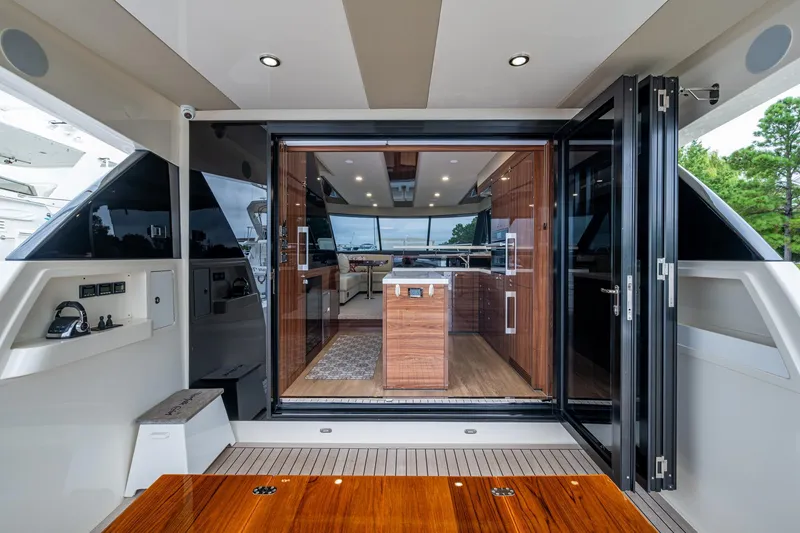 Slide: The Image of 2023 Maritimo M55 yacht interior with modern kitchen and sleek design. - 27
