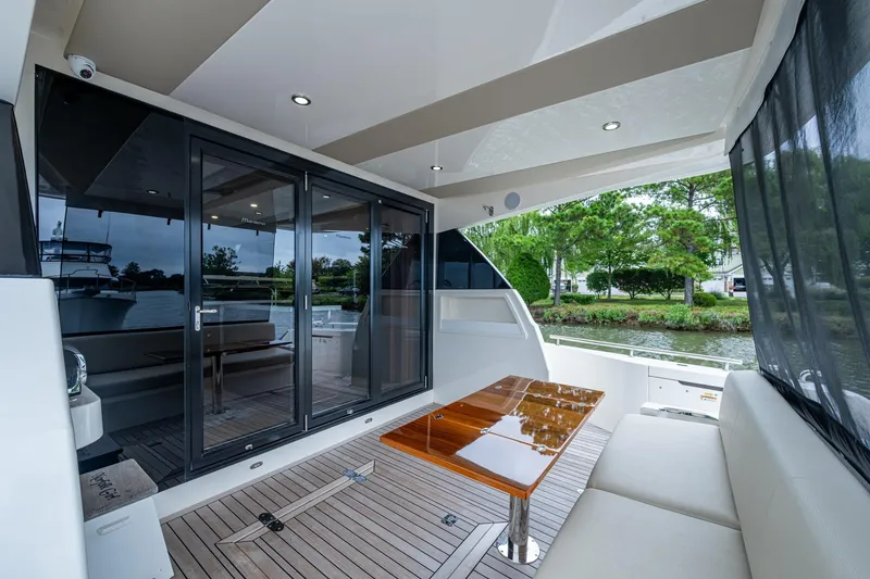 Slide: The Image of Luxurious 2023 Maritimo M55 yacht interior with sleek design and spacious seating area. - 29