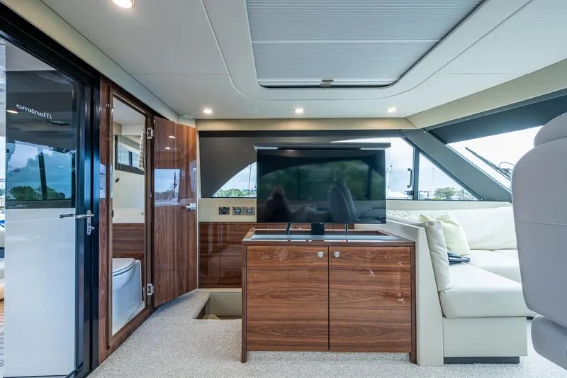 Slide: The Image of Luxurious interior of 2023 Maritimo M55 yacht with modern furnishings and large windows. - 31
