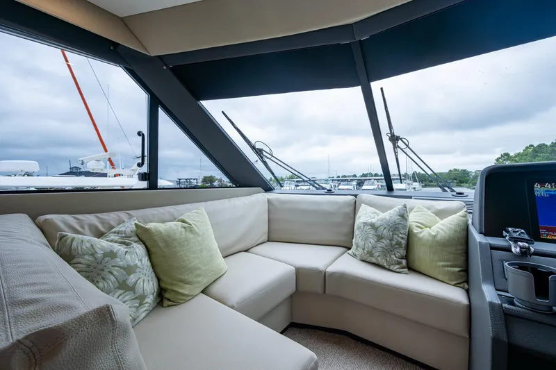 Slide: The Image of Luxurious interior of 2023 Maritimo M55 yacht with plush seating and scenic window views. - 39