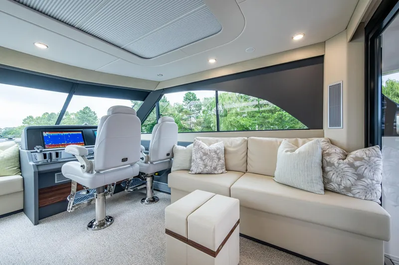 Slide: The Image of Luxurious interior of 2023 Maritimo M55 yacht with plush seating and modern helm. - 40