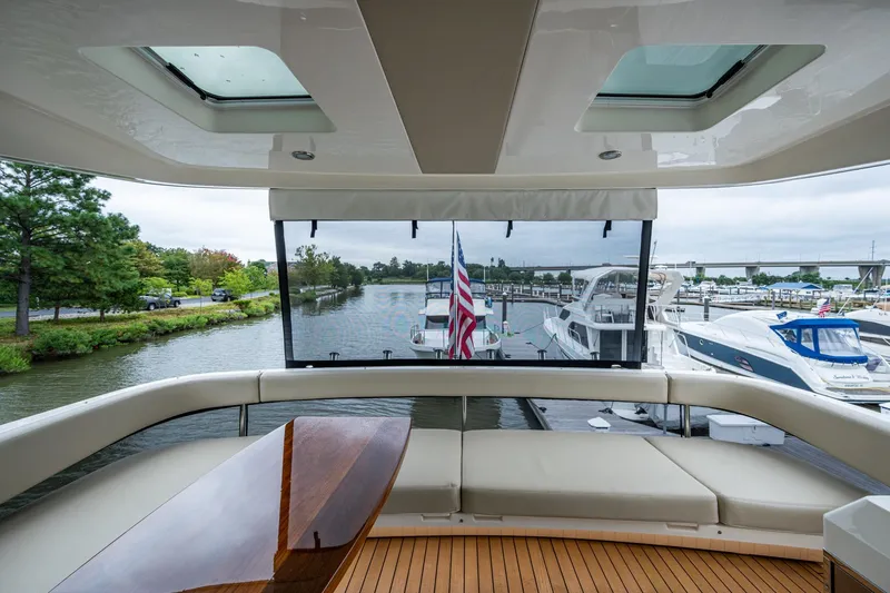 Slide: The Image of Luxurious 2023 Maritimo M55 yacht interior with scenic marina view. - 45
