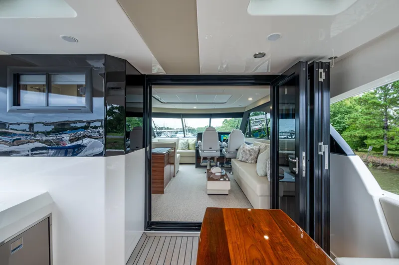 Slide: The Image of 2023 Maritimo M55 yacht interior with luxurious seating and modern design. - 49