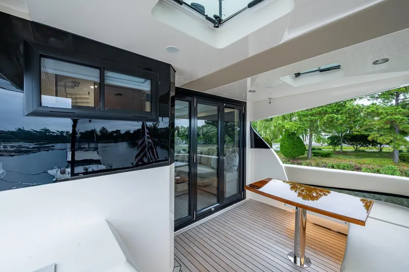 Slide: The Image of 2023 Maritimo M55 yacht deck with sleek design and modern furnishings. - 50