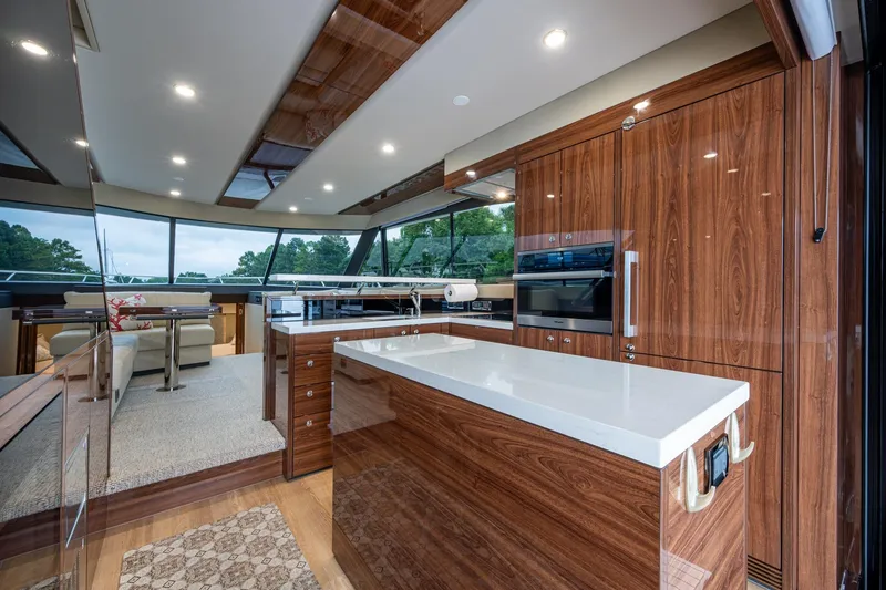 Slide: The Image of Luxurious interior of 2023 Maritimo M55 yacht with modern kitchen and panoramic windows. - 52