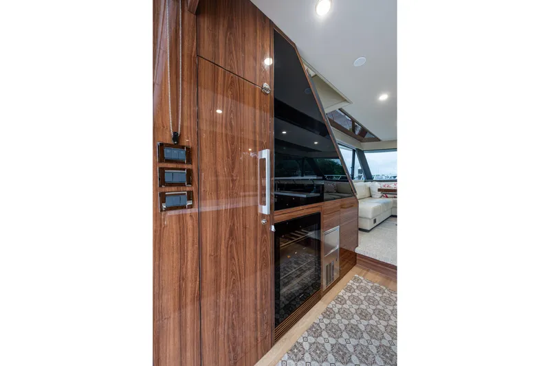 Slide: The Image of Luxurious interior of 2023 Maritimo M55 yacht with elegant wood paneling and modern design. - 56