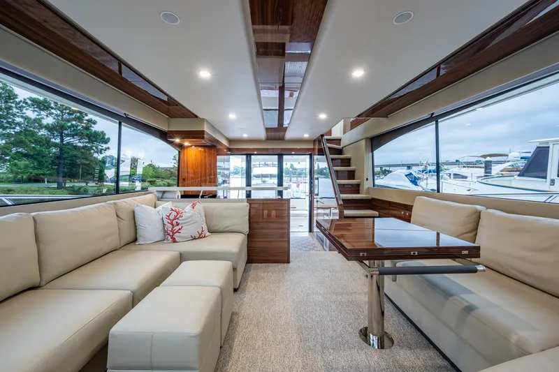 Slide: The Image of Luxurious interior of 2023 Maritimo M55 yacht with elegant seating and panoramic windows. - 63