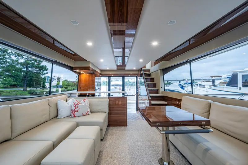 Slide: The Image of Luxurious interior of 2023 Maritimo M55 yacht with elegant seating and panoramic windows. - 64