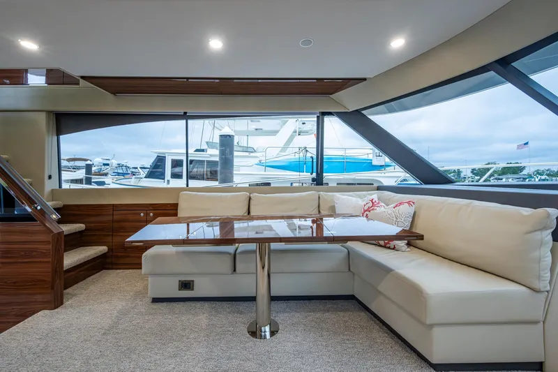 Slide: The Image of Luxurious interior of 2023 Maritimo M55 yacht with elegant seating and large windows. - 66