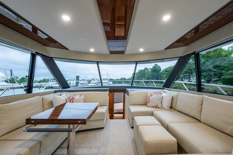 Slide: The Image of Luxurious interior of 2023 Maritimo M55 yacht with elegant seating and panoramic windows. - 67