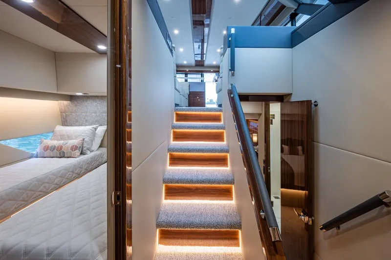 Slide: The Image of Luxurious interior of 2023 Maritimo M55 yacht with illuminated stairs and cozy bedroom. - 72