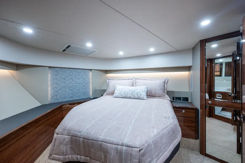 Slide: The Image of Luxurious bedroom interior of 2023 Maritimo M55 yacht with elegant bedding and modern lighting. - 78