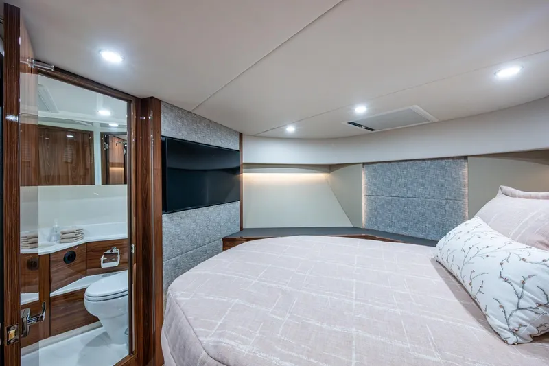 Slide: The Image of Luxurious 2023 Maritimo M55 yacht bedroom with ensuite bathroom, modern design, and elegant decor. - 79
