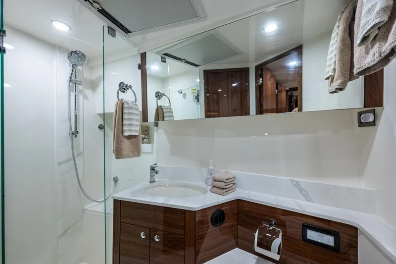 Slide: The Image of Luxurious bathroom in 2023 Maritimo M55 yacht with modern fixtures and elegant design. - 82