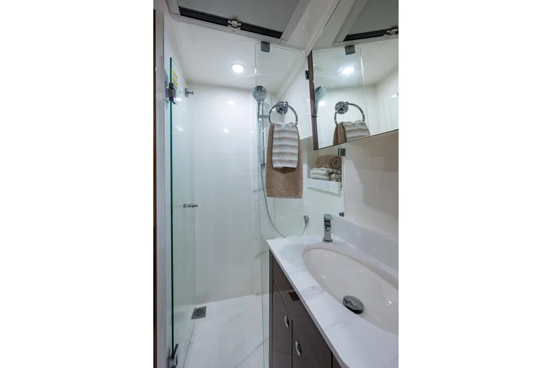 Slide: The Image of Luxurious bathroom in 2023 Maritimo M55 yacht with modern fixtures and elegant design. - 84