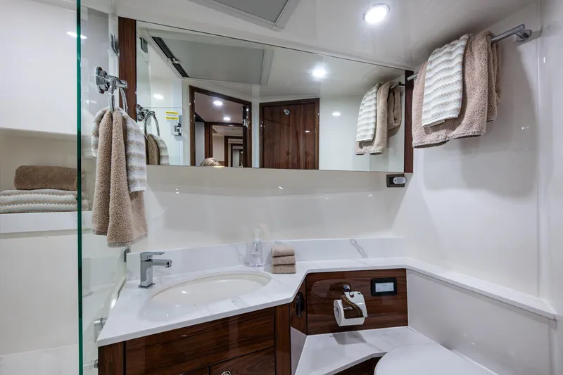 Slide: The Image of Luxurious bathroom in 2023 Maritimo M55 yacht with modern fixtures and elegant design. - 85