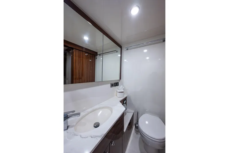 Slide: The Image of Luxurious bathroom in 2023 Maritimo M55 yacht with modern fixtures and elegant design. - 91