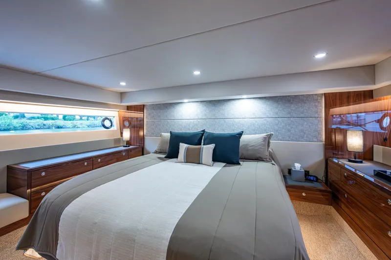 Slide: The Image of Luxurious bedroom interior of 2023 Maritimo M55 yacht with elegant wood finishes. - 96