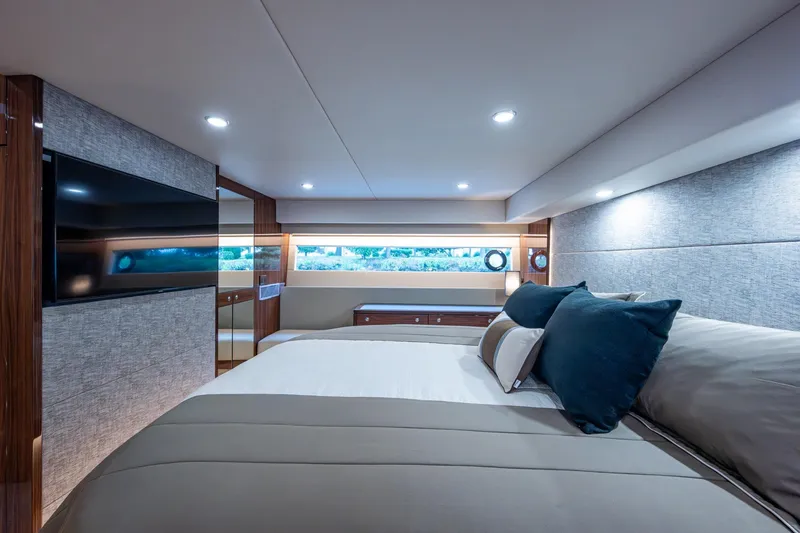 Slide: The Image of Luxurious interior of 2023 Maritimo M55 yacht bedroom with modern design and ambient lighting. - 98
