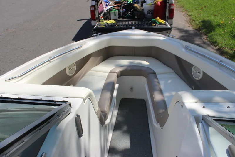 Slide: The Image of 2006 Cobalt 246 boat interior with spacious seating and modern design. - 12