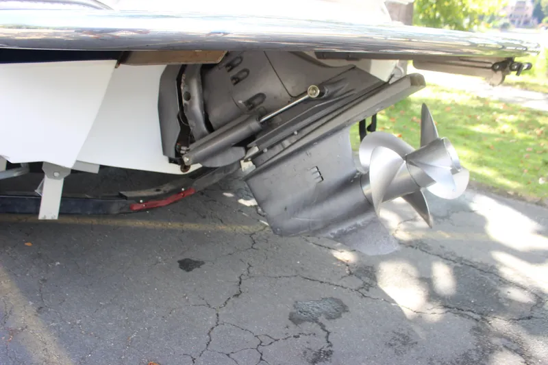 Slide: The Image of 2006 Cobalt 246 boat propeller and stern drive on pavement. - 17